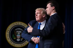 President Donald J. Trump shakes hands with Charlie Kirk, Founder and Executive Director of Turning Point USA, during a panel discussion at the White House complex on Thursday, March 22, 2018 in Washington, DC. (Photo by Jabin Botsford/The Washington Post via Getty Images)