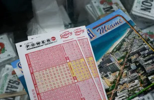 MIAMI, FLORIDA - AUGUST 26: Powerball lottery ticket forms are displayed at the Downtown Miami Souvenirs store on August 26, 2025 in Miami, Florida. The Powerball jackpot has climbed to $815 million ahead of Wednesday's drawing, making the jackpot the 10th-largest in Powerball history. (Photo by Joe Raedle/Getty Images)