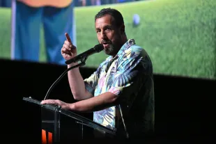 Adam Sandler speaks onstage during the Happy Gilmore 2 World Premiere at Jazz at Lincoln Center. (Photo by Roy Rochlin/Getty Images for Netflix)