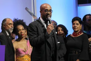 Dr. Frederick Douglass Haynes III (C) speaks onstage during the National CARES Mentoring Movement 4th Annual For The Love Of Our Children Gala (Image via Getty)