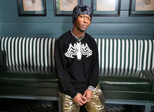 Details about D4vd's alleged matching tattoos with Celeste Rivas and unreleased song surface. (Image by Michael Kovac/Getty Images)