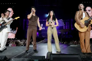 EAST RUTHERFORD, NEW JERSEY - AUGUST 10: (L-R) Nick Jonas, Joe Jonas, Demi Lovato, and Kevin Jonas perform onstage during the Jonas Brothers: JONAS20 Greetings From Your Hometown tour kick off at Met Life Stadium on August 10, 2025 in East Rutherford, New Jersey. (Photo by Kevin Mazur/Getty Images for Live Nation)