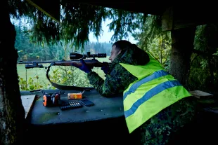 A hunter is patiently waiting for a moose on the first day of the hunting season on October 22, 2014, in Holmsjoe, Sweden. (Photo by Bo Nymann/ Getty Images)