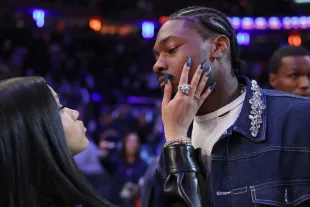 NFL Player Stefon Diggs (R) and rapper Cardi B (L) celebrate after Game Four of the Eastern Conference Second Round NBA Playoffs (Image via Getty)