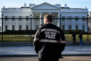 WASHINGTON, DC - MARCH 09: A U.S. Secret Service Uniformed Division officer patrols near the White House on March 09, 2025 in Washington, DC. An armed man was shot by U.S. Secret Service personnel Sunday morning following a confrontation outside the White House. (Photo by Kevin Dietsch/Getty Images)