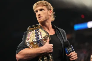 CLEVELAND, OHIO - AUGUST 2: United States Champion Logan Paul addresses the crowd during SmackDown at Rocket Mortgage FieldHouse on August 2, 2024 in Cleveland, Ohio.  (Photo by WWE/Getty Images)