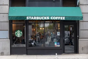 A store front of a Starbucks Coffee shop located in Broadway Avenue in Manhattan NY. (Photo by Nicolas Economou/NurPhoto via Getty Images)