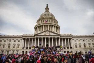 Ray Epps, a pro-Trump supporter, was accused of being an FBI plant at Jan 6 Capitol attack (Image via Jon Cherry/Getty Images)