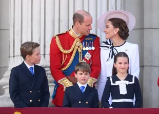 LONDON, ENGLAND - JUNE 15: Prince George of Wales, Prince William, Prince of Wales, Prince Louis of Wales, Princess Charlotte of Wales and Catherine, Princess of Wales on the balcony of Buckingham Palace during Trooping the Colour on June 15, 2024 in London, England. Trooping the Colour is a ceremonial parade celebrating the official birthday of the British Monarch. The event features over 1,400 soldiers and officers, accompanied by 200 horses. More than 400 musicians from ten different bands and Corps of Drums march and perform in perfect harmony. (Photo by Karwai Tang/WireImage)