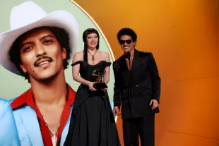 LOS ANGELES, CALIFORNIA - FEBRUARY 02: (L-R) Lady Gaga and Bruno Mars accept the Best Pop Duo/Group Performance Award for "Die with a Smile" onstage during the 67th Annual GRAMMY Awards at Crypto.com Arena on February 02, 2025 in Los Angeles, California.  (Photo by Kevin Mazur/Getty Images for The Recording Academy)