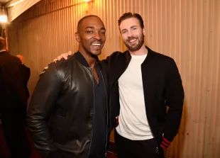 Actors Anthony Mackie (L) and Chris Evans attend the 2016 MTV Movie Awards at Warner Bros. Studios on April 9, 2016 in Burbank, California.  MTV Movie Awards airs April 10, 2016 at 8pm ET/PT.  (Photo by Kevin Mazur/WireImage for MTV)