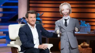 Robert Herjavec with a Gerty doll in Shark Tank (Image via Instagram @sharktankabc)