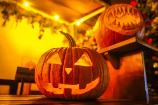 Halloween pumpkin decorations are seen outside a restaurant  in Krakow, Poland on October 30, 2023. (Photo by Beata Zawrzel/NurPhoto via Getty Images)