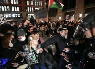 NEW YORK, US - APRIL 22: Police intervene and arrest more than 100 students at New York University (NYU) who continue their demonstration on campus in solidarity with the students at Columbia University and to oppose Israel's attacks on Gaza, in New York, United States on April 22, 2024. Pro-Palestinian protesters have launched a wave of protests on campus condemning Israel's offensive on the Gaza Strip, which has displaced over 75% of the coastal enclave's estimated 2.3 million people, and resulted in over 34,000 deaths, according to Gaza health officials. (Photo by Fatih Aktas/Anadolu via Getty Images)