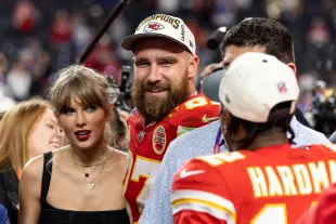 LAS VEGAS, NEVADA - FEBRUARY 11: Travis Kelce #87 of the Kansas City Chiefs and Taylor Swift react as they see Mecole Hardman Jr. #12 of the Kansas City Chiefs following the NFL Super Bowl 58 football game between the San Francisco 49ers and the Kansas City Chiefs at Allegiant Stadium on February 11, 2024 in Las Vegas, Nevada. (Photo by Michael Owens/Getty Images)