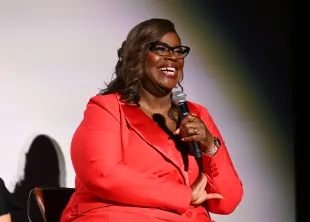 Retta speaks onstage during a Q&A at the Hit Man New York Fan Screening (Image via Getty)