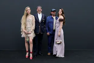 Caroline Grant, guest, Jeremy Dufrene and Lana Del Rey attend Valentino show as part of Paris Fashion Week on October 05, 2025 in Paris, France. (Photo by Vittorio Zunino Celotto/Getty Images for Valentino)