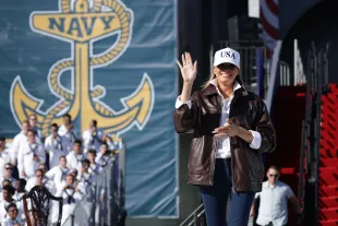 First Lady Melania Trump takes the stage as she prepares to make remarks during the Navy 250 Celebration aboard the USS Harry S. Truman aircraft carrier on October 5, 2025 in Norfolk, Virginia. (Photo by Alex Wong/Getty Images)