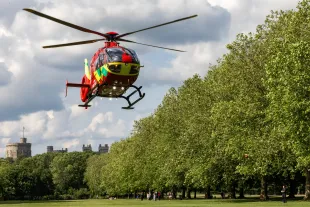 A Thames Valley Air Ambulance crew takes off from alongside the Long Walk in front of Windsor Castle after attending to a nearby road traffic accident on 21 June 2023 in Windsor, United Kingdom. Thames Valley Air Ambulance's new Airbus135 helicopter G-TVLY, which came into service in October 2022, has a top speed of 135mph and is able to reach any part of Berkshire, Buckinghamshire or Oxfordshire within 15 minutes. (photo by Mark Kerrison/In Pictures via Getty Images)