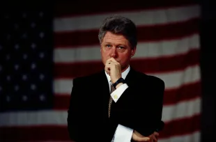 Portrait of emotional United States President Bill Clinton in front of the US flag. Clinton was the 42nd President of the United States during 1993 to 2001. (Photo by © Shepard Sherbell/CORBIS SABA/Corbis via Getty Images)