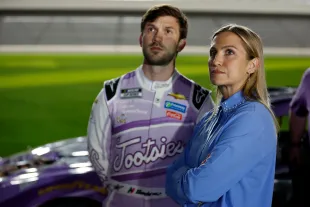 Julia Piquet  and Daniel Suarez, driver of the #99 Tootsies Orchid Lounge Chevrolet, look on during qualifying for the Busch Light Pole at Daytona International Speedway on February 15, 2023 in Daytona Beach, Florida. (Photo by Sean Gardner/Getty Images)