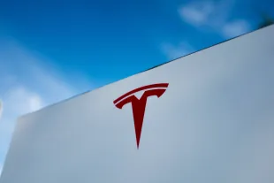 Close-up of Tesla Motors logo against a bright blue sky in Pleasanton, California, July 23, 2018. (Photo by Smith Collection/Gado/Getty Images)