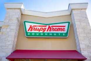 AUSTIN, TEXAS - FEBRUARY 13: The exterior of a Krispy Kreme store is seen on February 13, 2024 in Austin, Texas. Krispy Kreme Inc. today announced expected double-digit price increases in response to commodities and labor cost pressures. The Charlotte, North Carolina-based company's stock price fell by as much as 10% earlier after earnings guidance for the full year missed analysts' estimates.  (Photo by Brandon Bell/Getty Images)