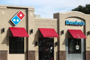 Domino's logo is seen on the restaurant in Streator, United States on October 15, 2022. (Photo by Jakub Porzycki/NurPhoto via Getty Images)