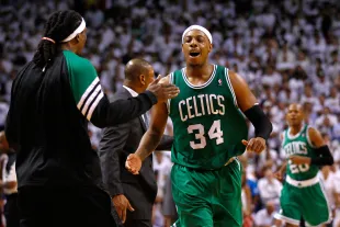 MIAMI, FL - JUNE 05:  Paul Pierce #34 and Marquis Daniels #4 of the Boston Celtics celebrate after Pierce made a 3-point basket in the final minute of the fourt quarter to give the Celtics a 90-86 lead against the Miami Heat  in Game Five of the Eastern Conference Finals in the 2012 NBA Playoffs on June 5, 2012 at American Airlines Arena in Miami, Florida. NOTE TO USER: User expressly acknowledges and agrees that, by downloading and or using this photograph, User is consenting to the terms and conditions of the Getty Images License Agreement.  (Photo by Mike Ehrmann/Getty Images)