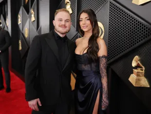 Zach Bryan and Brianna LaPaglia attend the 66th GRAMMY Awards (Image via Getty)