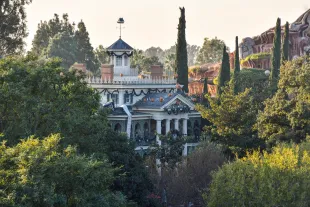 Disneyland's Haunted Mansion seen from Tarzan's Treehouse in Anaheim, California, on Thursday, Dec 14, 2017.  The Haunted Mansion. It was originally conceived to look spooky and dilapidated on the outside, but Walt Disney didn't want anything shabby in his park, so that plan was discarded. Designers first thought they would build a walk-through attraction, but later added the "doom buggies" to the design to improve traffic flow.  (Photo by Jeff Gritchen/Digital First Media/Orange County Register via Getty Images)
