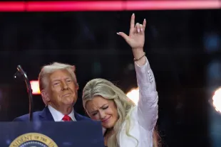Erika Kirk joins U.S. President Donald Trump onstage during the memorial service for political activist Charlie Kirk at State Farm Stadium on September 21, 2025 in Glendale, Arizona. (Photo by Win McNamee/Getty Images)