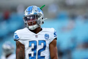 CHARLOTTE, NORTH CAROLINA - AUGUST 25: Brian Branch #32 of the Detroit Lions looks on prior to a preseason game against the Carolina Panthers at Bank of America Stadium on August 25, 2023 in Charlotte, North Carolina. (Photo by Jared C. Tilton/Getty Images)
