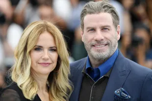 Kelly Preston and John Travolta attend the photocall for "Rendezvous With John Travolta - Gotti" during the 71st annual Cannes Film Festival (Image via Getty)
