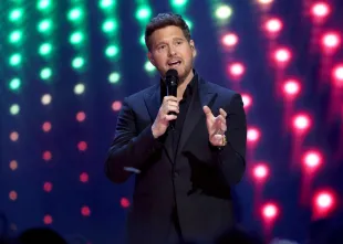 The Voice coash Michael Bublé speaks onstage during the 2025 JUNO Awards (Image via Getty)
