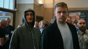 Tom Brooke as JK Coe and Jack Lowden as River Cartwright in Slow Horses season 5, Missiles, moments before the campaign chaos that changes the race. Photo courtesy of Apple TV+