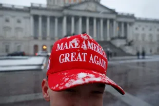 WASHINGTON, DC - JANUARY 19: Trump supporter JT Whitaker from Gunnersville, Alabama wears a Make America Great Again hat in the snow on January 19, 2025 in Washington, DC. U.S. President-elect Donald Trump and Vice President-elect  JD Vance  will be sworn in on January 20. (Photo by Kevin Dietsch/Getty Images)