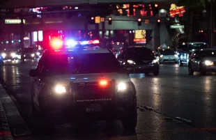 A representational image of a police cruiser at night. (Image via Kenny Eliason/Unsplash)