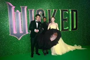 Director of Wicked, Jon M. Chu, and the stars Cynthia Erivo and Ariana Grande (Image via Getty)