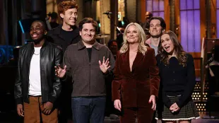 SATURDAY NIGHT LIVE -- Episode 1886 -- Pictured: (l-r) Kam Patterson, Ben Marshall, Jeremy Culhane, host Amy Poehler, Tommy Brennan, and Veronika Slowikowska during the Monologue on Saturday, October 11, 2025 -- (Photo by: Will Heath/NBC via Getty Images)