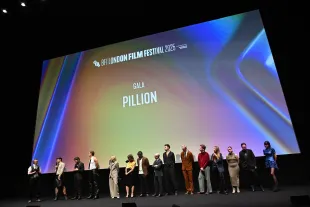 LONDON, ENGLAND - OCTOBER 18: (L-R) BFI CEO Ben Roberts, Director Harry Lighton, Harry Melling and Alexander Skarsgård, Lesley Sharp, Emma Norton, Lee Groombridge, Ed Guiney and guests onstage during the "Pillion" Headline Gala at the 69th BFI London Film Festival at The Royal Festival Hall on October 18, 2025 in London, England. (Photo by Kate Green/Getty Images for BFI)