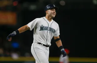 Jesus Montero #63 of the Seattle Mariners rounds the bases after hitting a three-run home run (Image via Getty)
