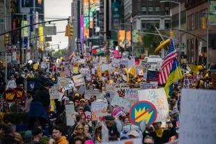 Over one hundred thousand people gather and march in Manhattan, New York City, on October 18, 2025, for the No Kings protest. Peaceful demonstrations take place across the country as millions advocate against the policies of the Trump Administration. No arrests are made in New York City. (Photo by Neil Constantine/NurPhoto via Getty Images)