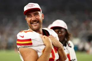 JACKSONVILLE, FL - AUGUST 10: Travis Kelce #87 of the Kansas City Chiefs smiles on the sidelines during the second quarter of an NFL preseason football game against the Jacksonville Jaguars at EverBank Stadium on August 10, 2024 in Jacksonville, Florida. (Photo by Kevin Sabitus/Getty Images)