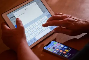 PRODUCTION - 09 February 2023, Baden-Württemberg, Stuttgart: ILLUSTRATION - A woman types an e-mail on an iPad (posed scene). On February 10, the data protection commissioner of the state of Baden-Württemberg announces his activity report on data protection 2022. Photo: Bernd Weißbrod/dpa (Photo by Bernd Weißbrod/picture alliance via Getty Images)