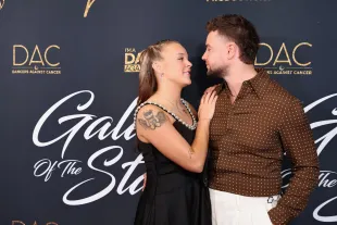 BEVERLY HILLS, CALIFORNIA - OCTOBER 21: JoJo Siwa and Chris Hughes attend Dancers Against Cancer's 2025 Gala of the Stars at The Beverly Hilton on October 21, 2025 in Beverly Hills, California.  (Photo by Robin L Marshall/Getty Images)