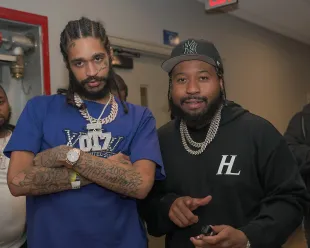 ATLANTIC CITY, NEW JERSEY - JUNE 14: OT7 Quanny and DJ Akademiks attends Vybz Kartel Performs In Atlantic City on June 14, 2025 in Atlantic City, New Jersey. (Photo by Johnny Nunez/WireImage)