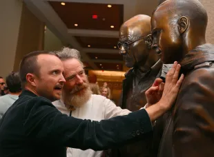 ALBUQUERQUE, NEW MEXICO - JULY 29:  Actor Aaron Paul (L) and actor Bryan Cranston examine bronze statues depicting television characters Walter White, played by Cranston, and Jesse Pinkman, played by Paul, from the series "Breaking Bad" at the Albuquerque Convention Center on July 29, 2022 in Albuquerque, New Mexico. The statues were commissioned in 2019 by Sony Pictures Television and were sculpted by artist Trevor Grove and cast by Burbank, California-based American Fine Arts Foundry.  (Photo by Sam Wasson/Getty Images)