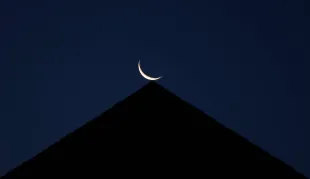 HOBOKEN, NJ - AUGUST 1: A 9 percent waning crescent moon rises before sunrise on August 1, 2024, in Hoboken, New Jersey.  (Photo by Gary Hershorn/Getty Images)
