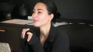 Kim Kardashian appears emotional during a conversation in The Kardashians season 7 teaser. Image via Hulu.